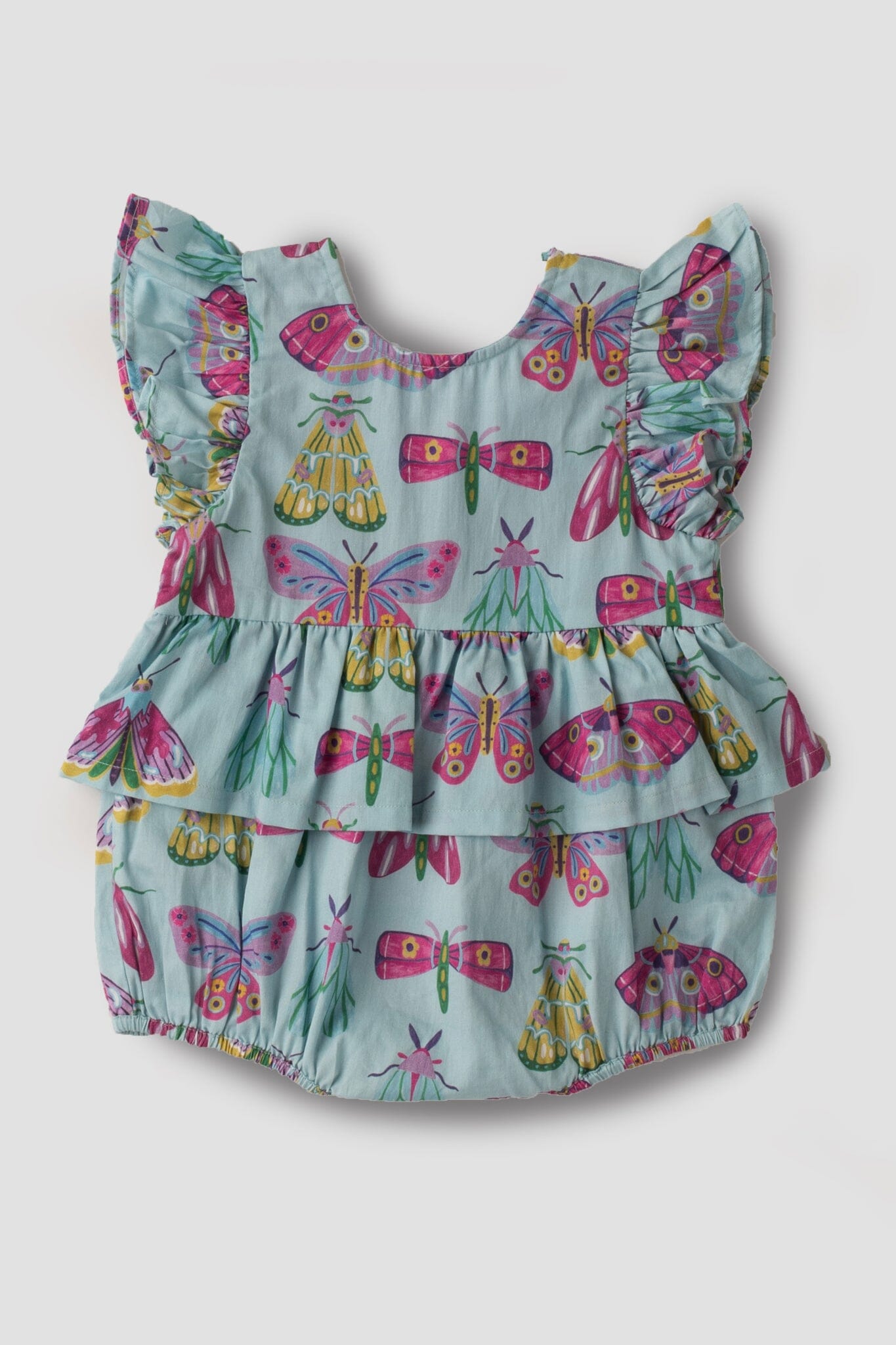 baby wearing a classic bubble romper with ruffle sleeves.