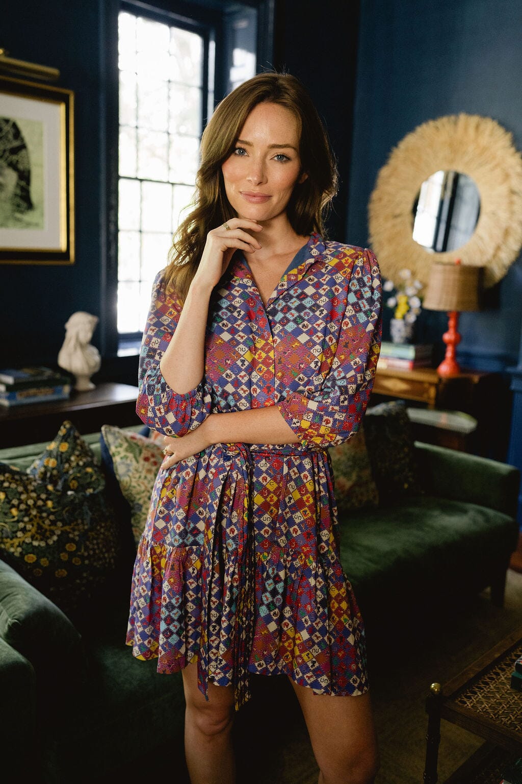 Model wearing Briton Court Hazel Mini Dress in Vintage Equestrian Diamond print, featuring jewel-tone diamond shapes and subtle equestrian motifs.