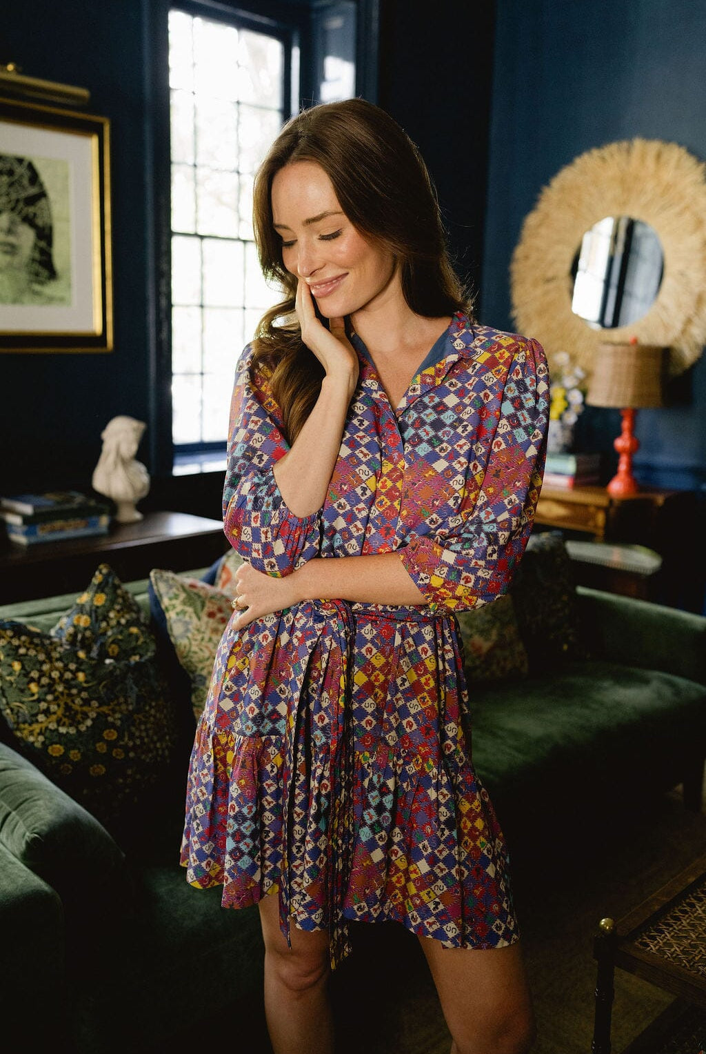Model wearing Briton Court Hazel Mini Dress in Vintage Equestrian Diamond print, featuring jewel-tone diamond shapes and subtle equestrian motifs.