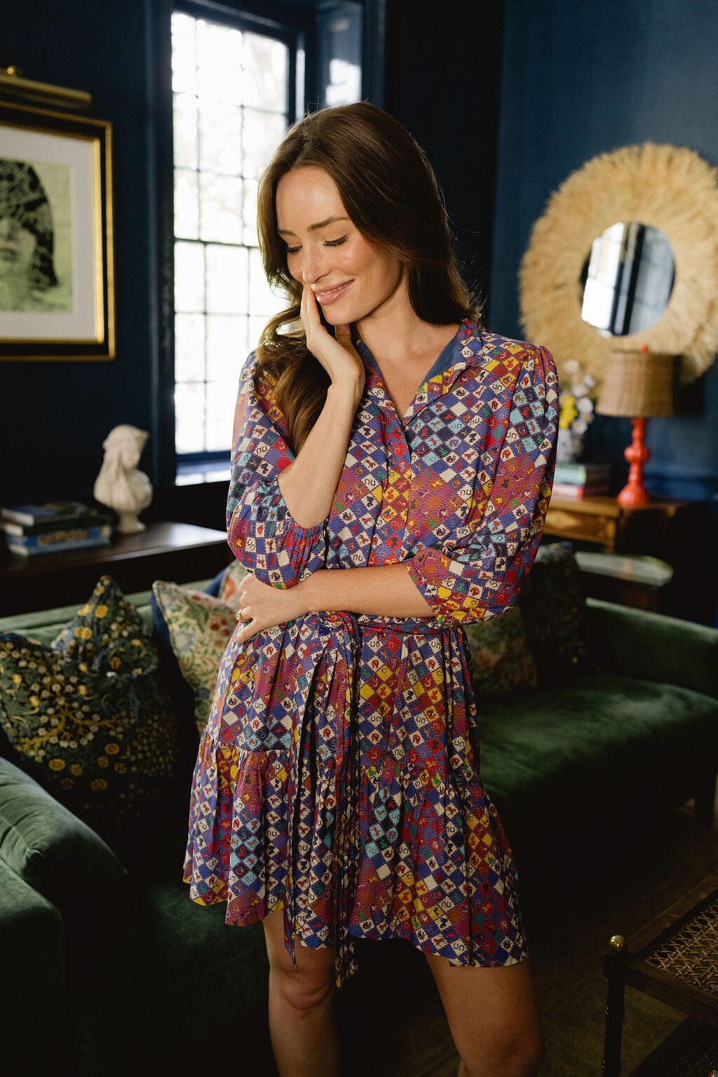 Model wearing Briton Court Hazel Mini Dress in Vintage Equestrian Diamond print, featuring jewel-tone diamond shapes and subtle equestrian motifs.