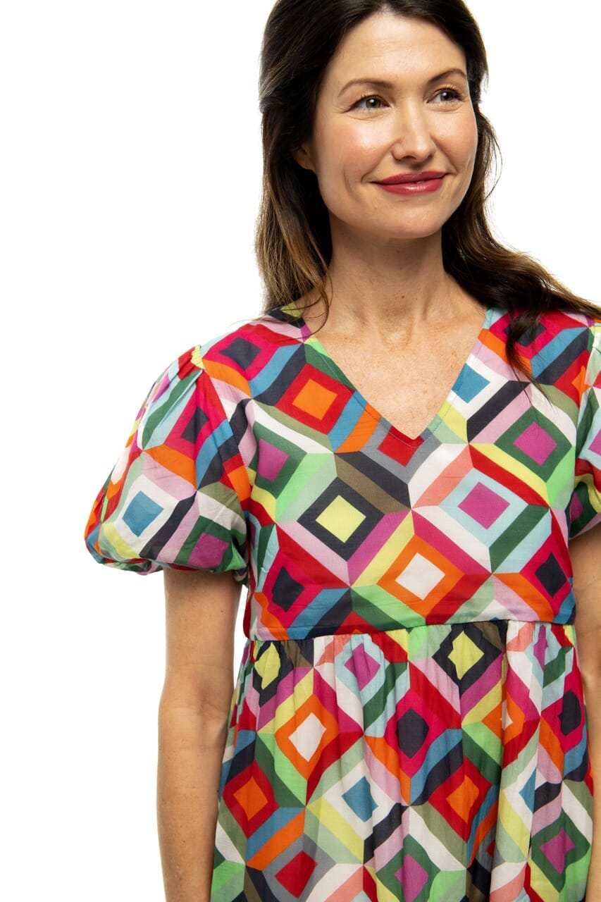 Up close picture of women smiling wearing Jetta Kaleidoscope dress.