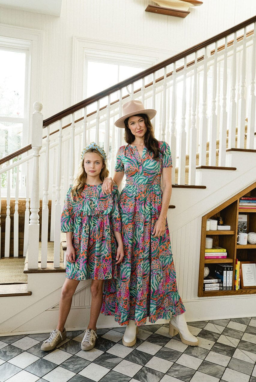 Woman and girl wearing matching Willow Ruffle Bib dress.