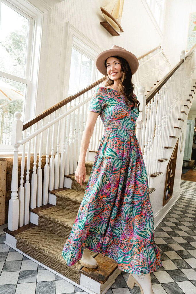 Woman smiling while wearing Willow Lime Punch Maxi dress.