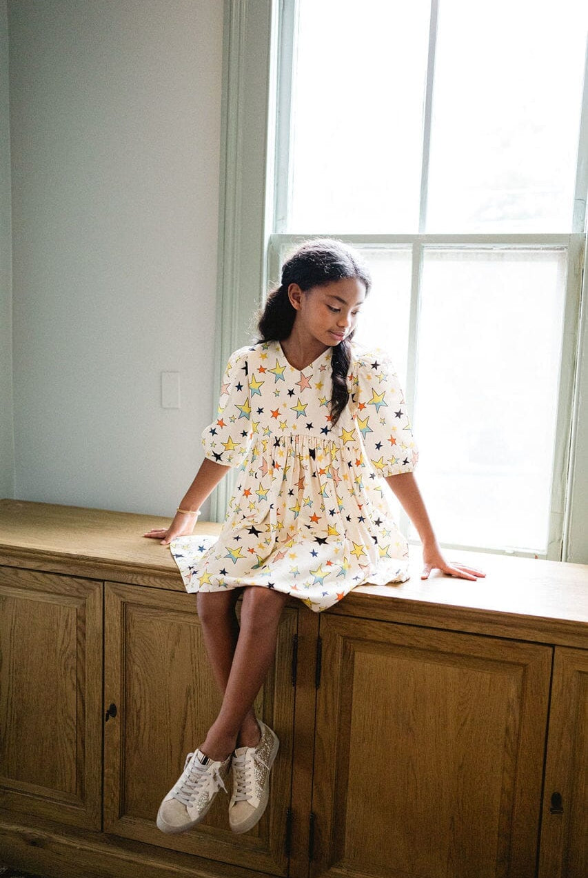 Girl wearing Briton Courts Luna Starlight dress.