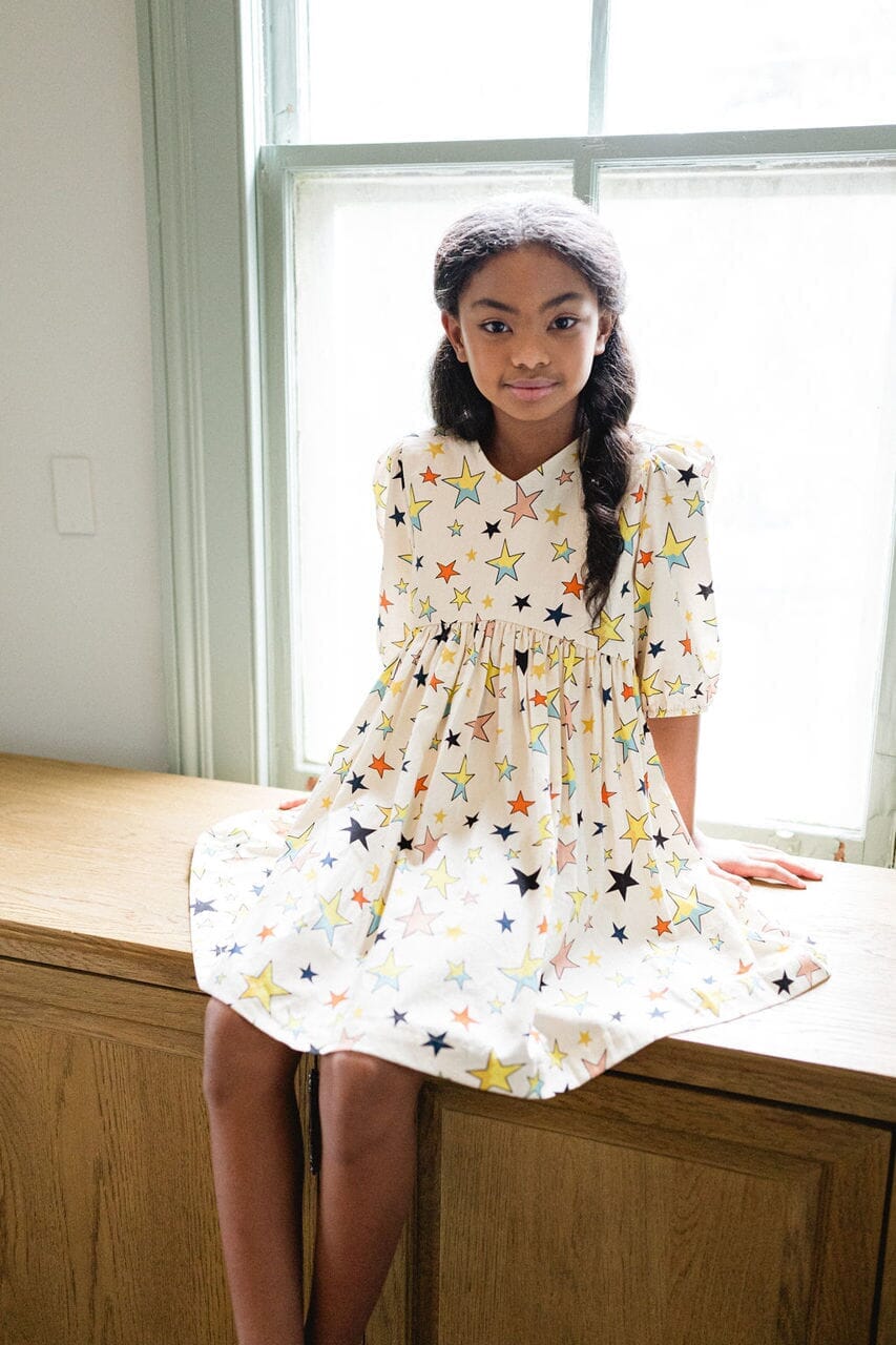 Girl wearing Briton Courts Luna Starlight dress.