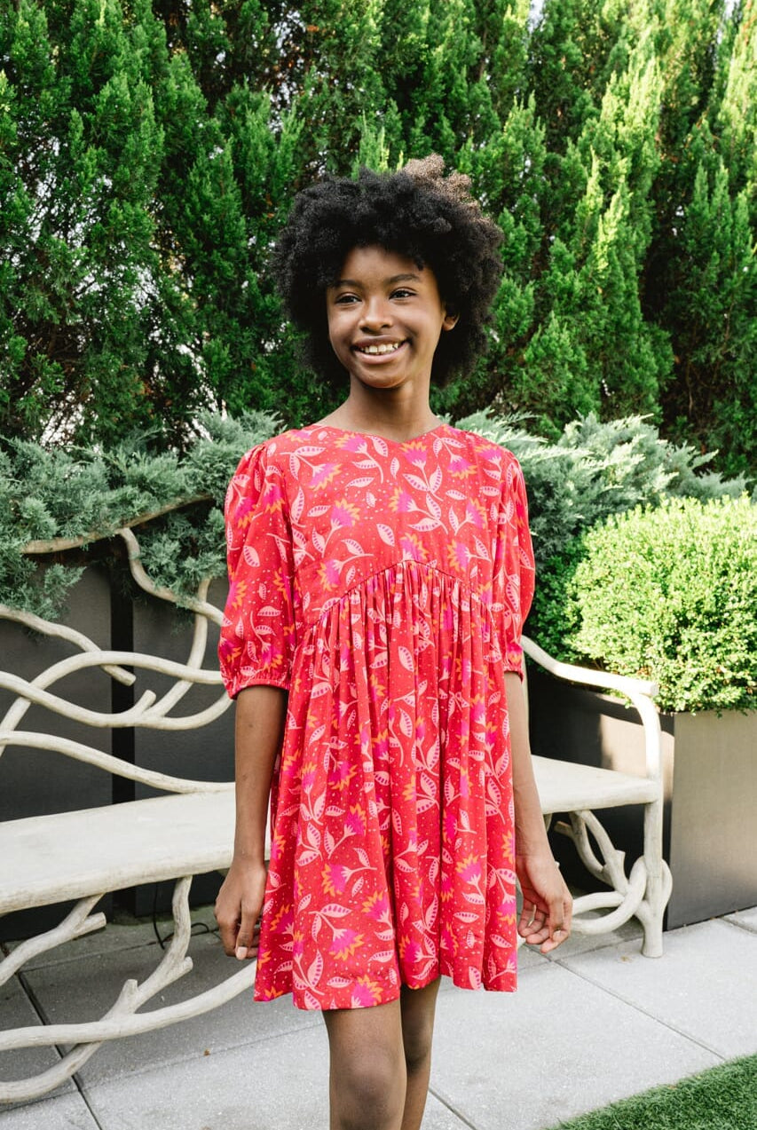 Girl wearing Briton Courts Wallflower Cherry Red dress.