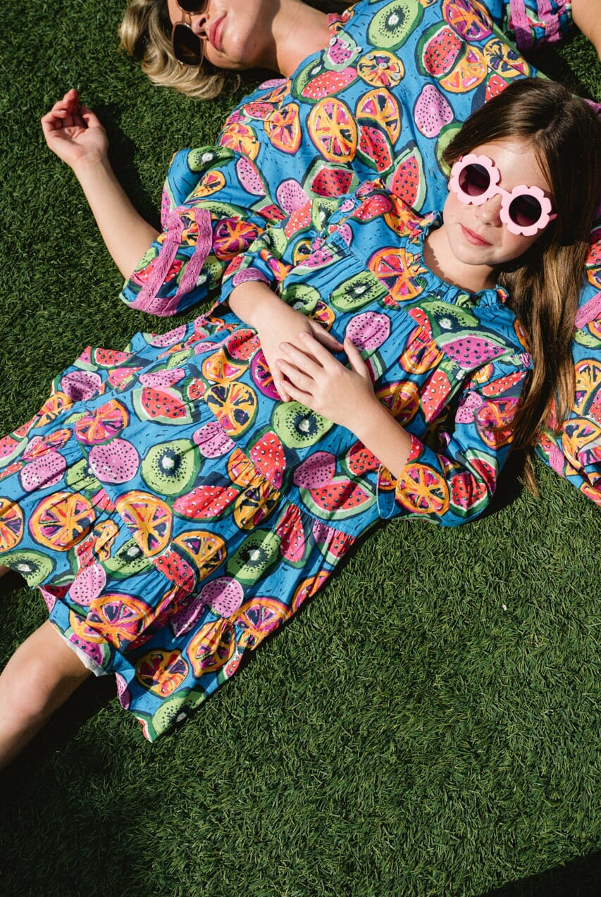 Woman and girl wearing Briton Court dress.
