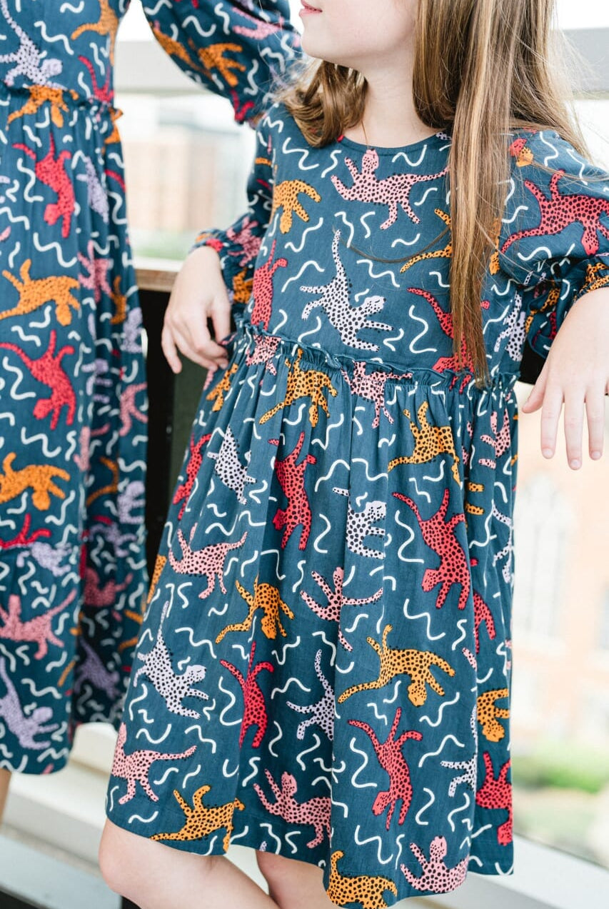 Close up picture of girl wearing Briton Courts Savannah Navy dress.