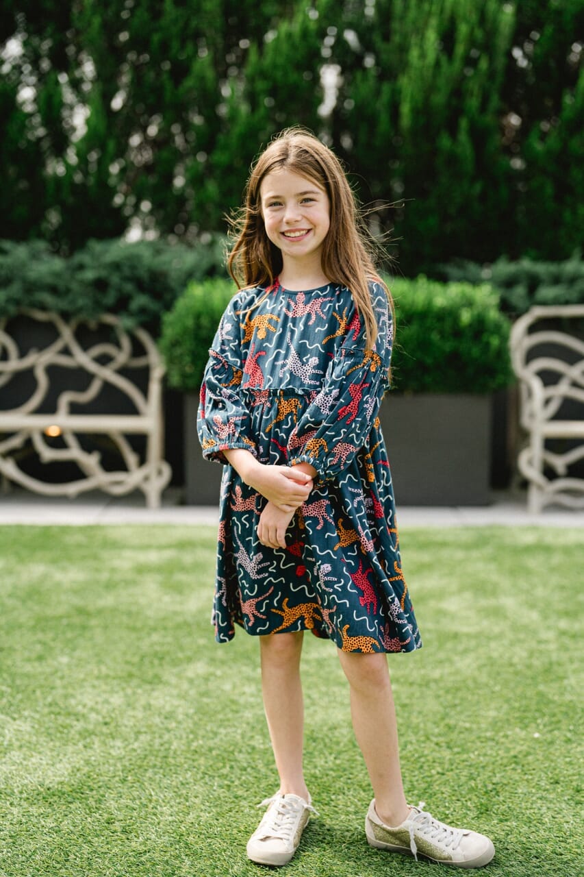 Girl wearing Briton Courts Savannah Navy dress.