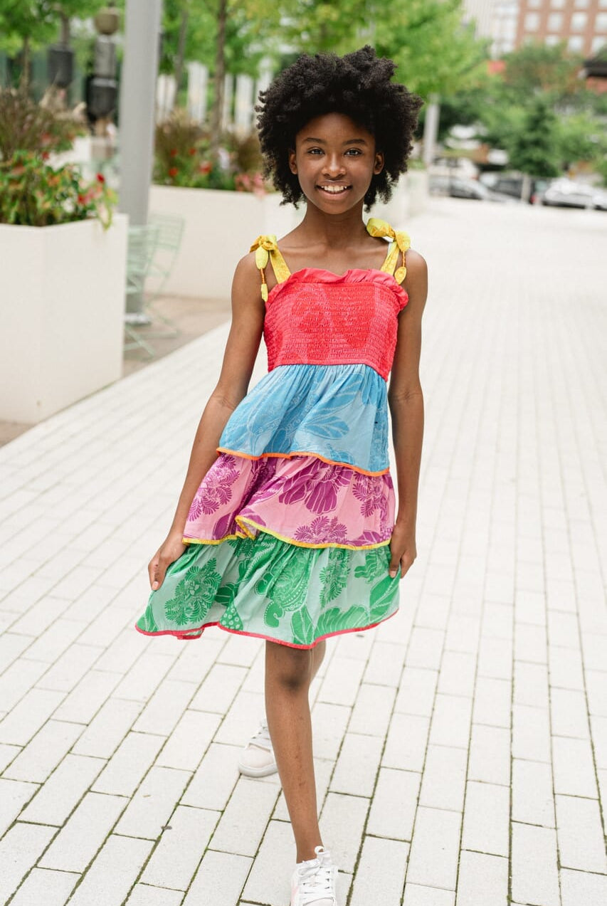 girl wearing rainbow tiered dress - briton court