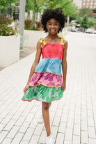 girl wearing rainbow tiered dress - briton court