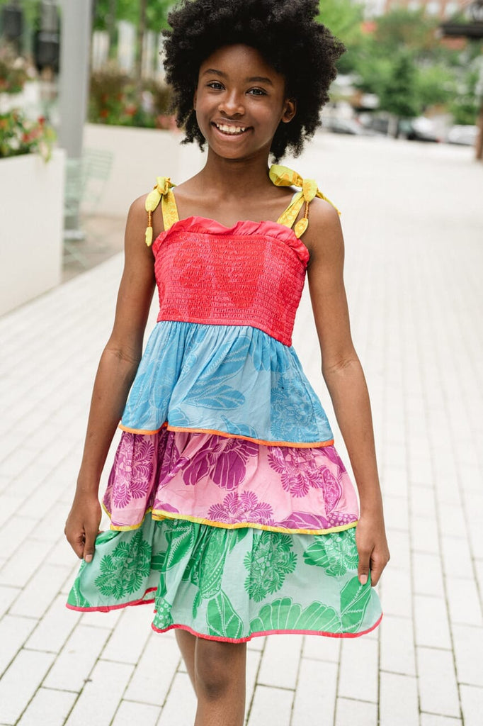 girl wearing rainbow tiered dress - briton court