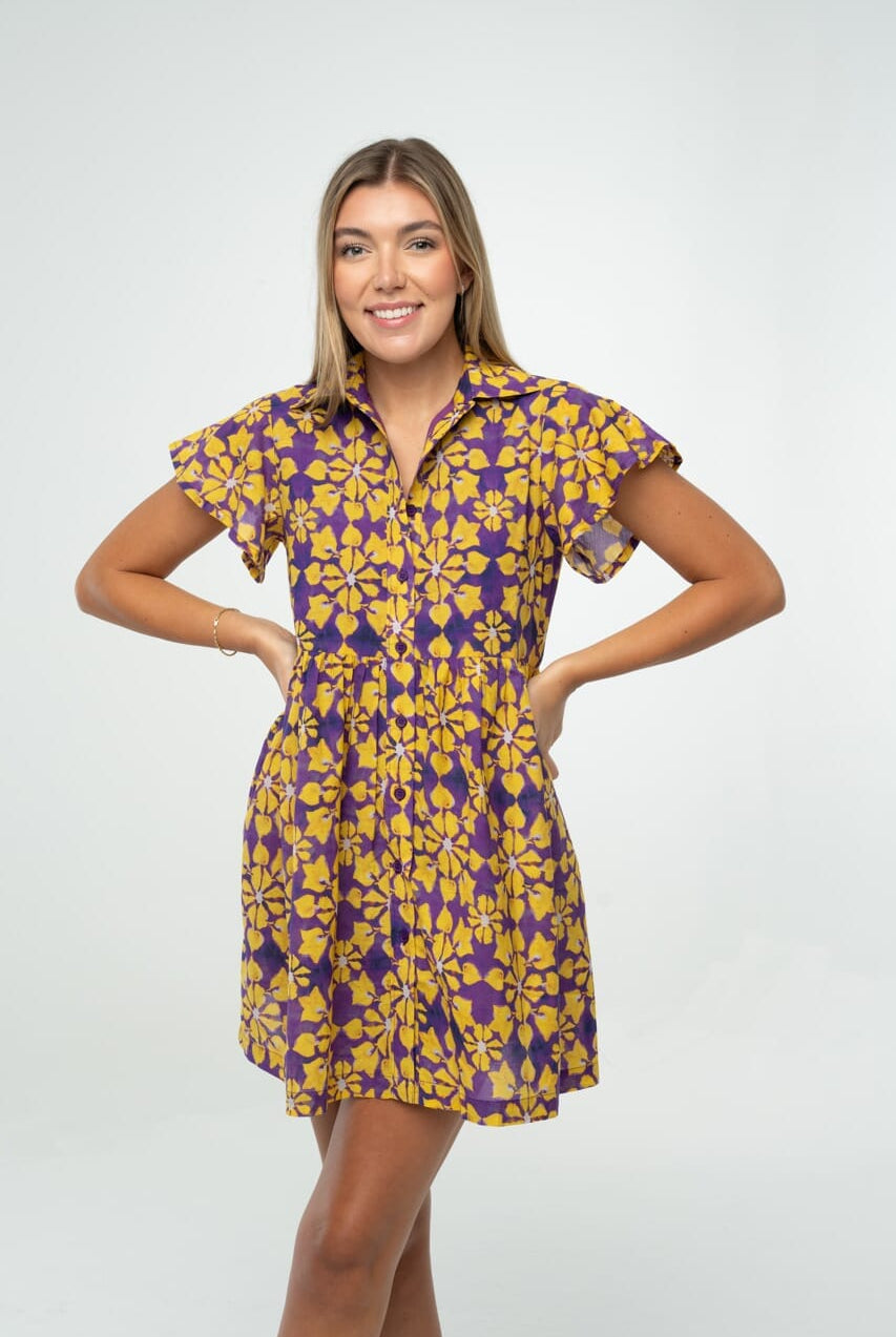 Purple and Gold floral gameday babydoll dress with flutter sleeves and button front, styled for tailgate or team spirit."