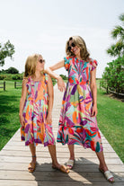 Woman and girl wearing Briton Court dresses.
