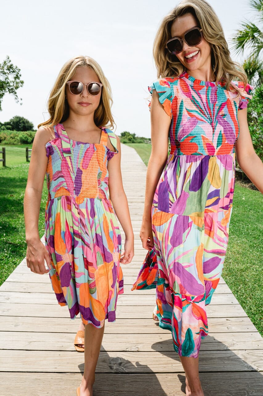Woman and girl wearing Briton Court dresses.