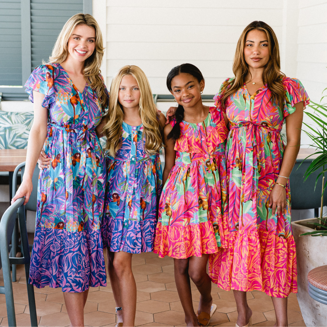 two girls and two women in briton court dresses