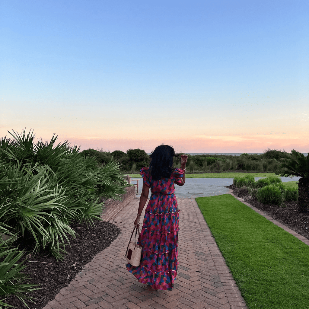 Woman in printed maxi dress - Briton Court