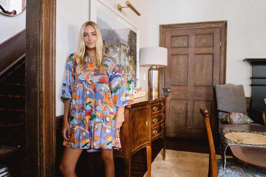 women in matching dresses at the beach 