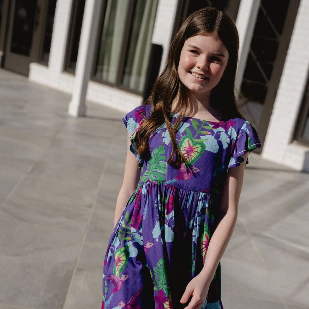 Girl wearing sleeveless colorful printed dress