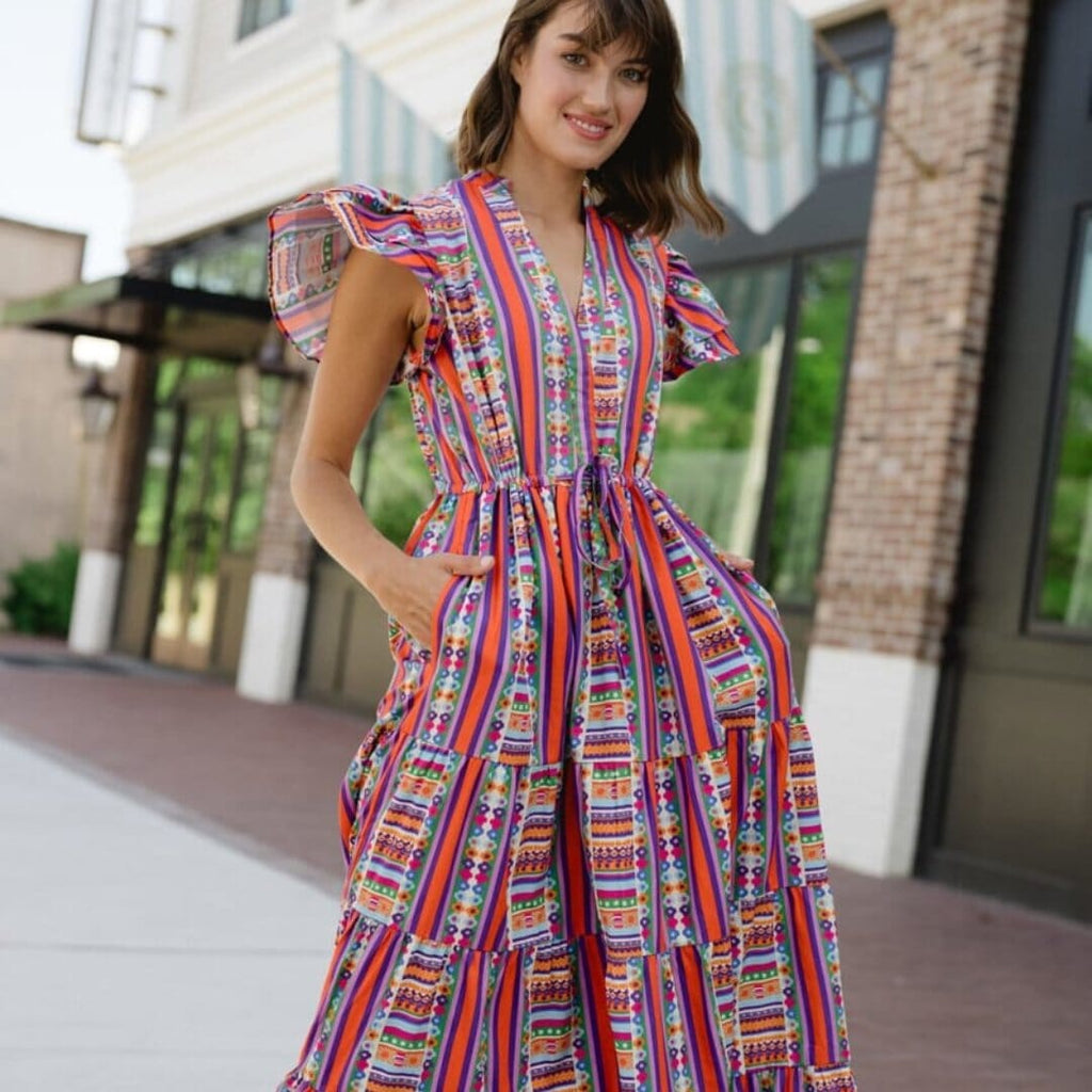 woman in a dress holding a football