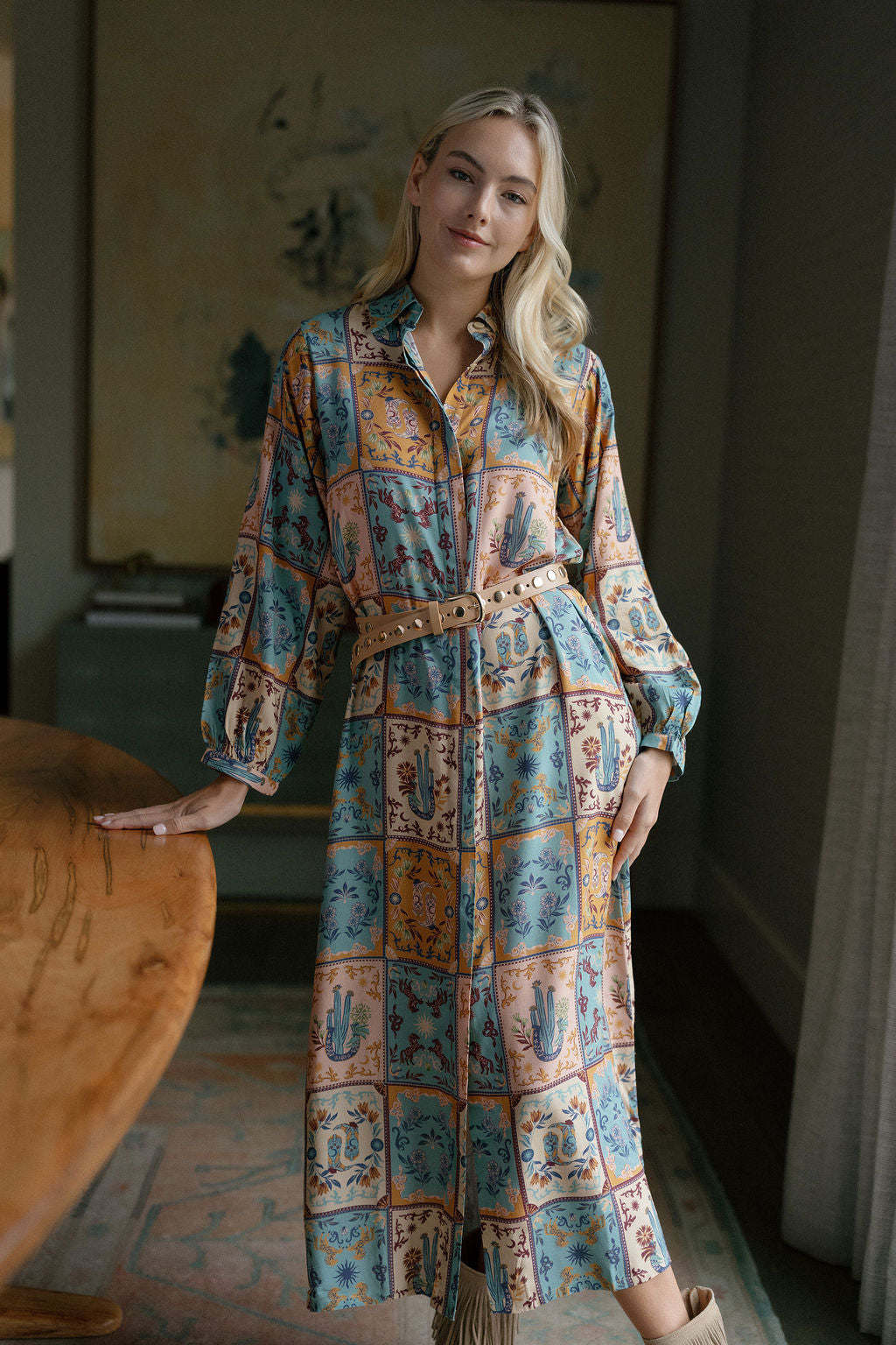 Woman wearing Sienna western patchwork maxi shirt dress with cowboy boots
