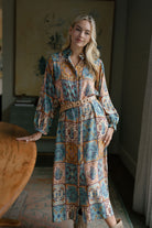 Woman wearing Sienna western patchwork maxi shirt dress with cowboy boots