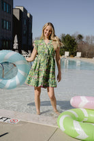 lady in beach dress by the pool