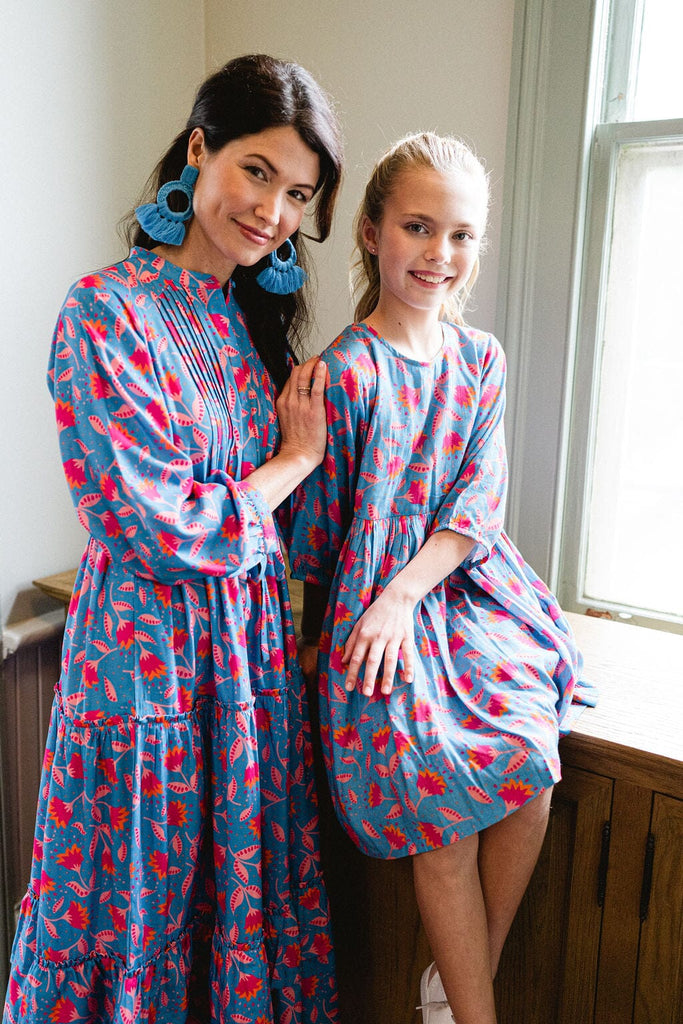 Woman and girl smiling wearing Briton Courts Blue Floral  Lotus Midi Dress.