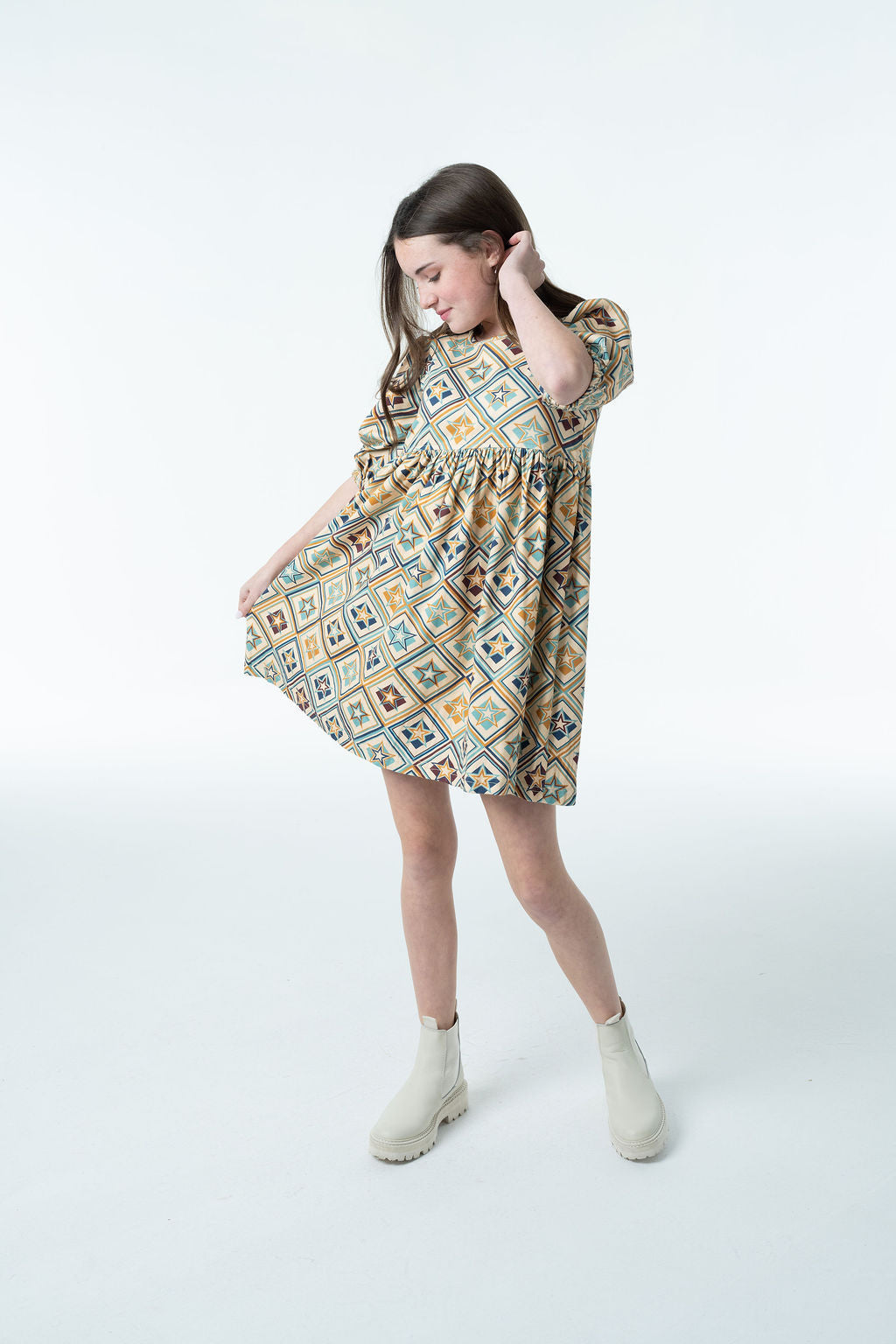 Girl wearing the Autumn Dress for a fall family photo
