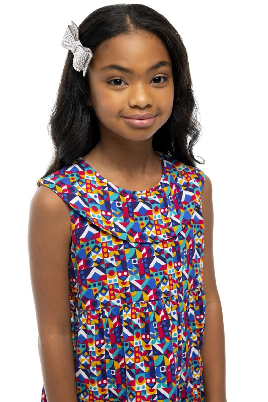 Closeup of girl wearing Briton Courts Laila Abstract Geo dress.