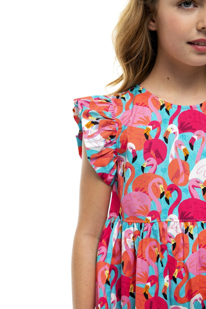 Up close picture of girl smiling while wearing Francie Flamingo dress