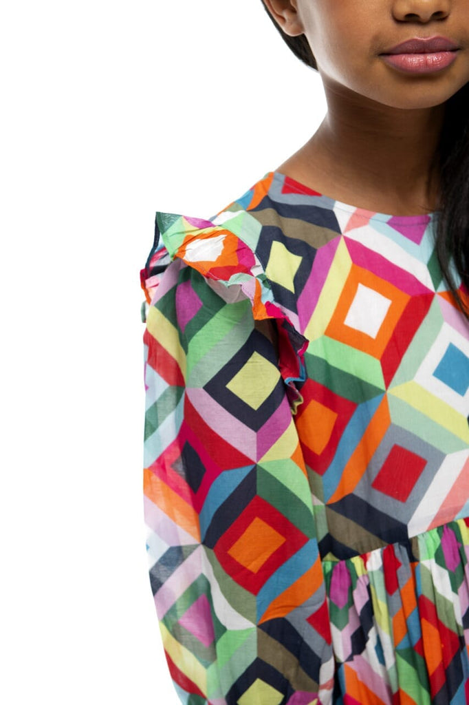 Upclose picture of girls shoulder to show design of Nova Kaleidoscope dress.