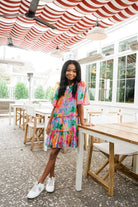 Girl smiling while wearing Kennedy Balloon Animals dress.