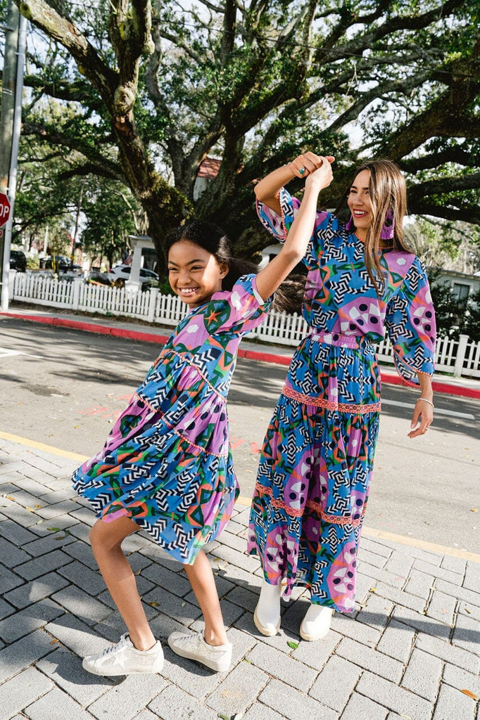 Woman and girl dancing while wearing Kaleidoscope Embroidered maxi skirt.