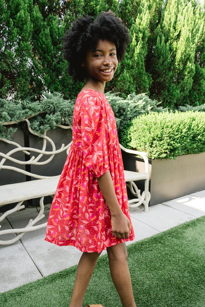 Girl wearing Briton Courts Wallflower Cherry Red dress.
