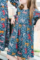 Close up picture of girl wearing Briton Courts Savannah Navy dress.