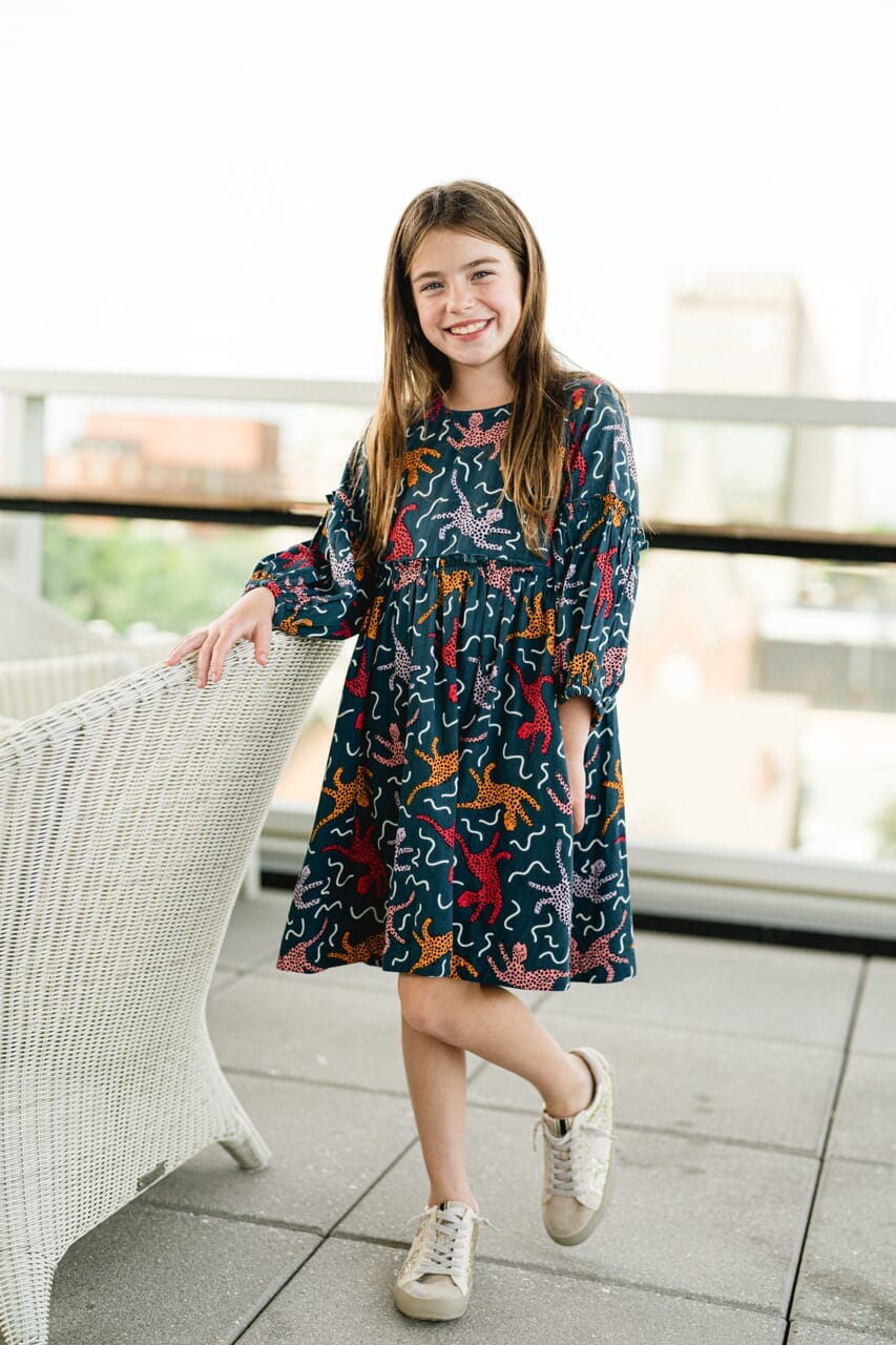 Girl wearing Briton Courts Savannah Navy dress.