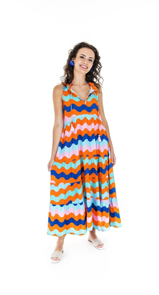 woman in bright wavy lines dress
